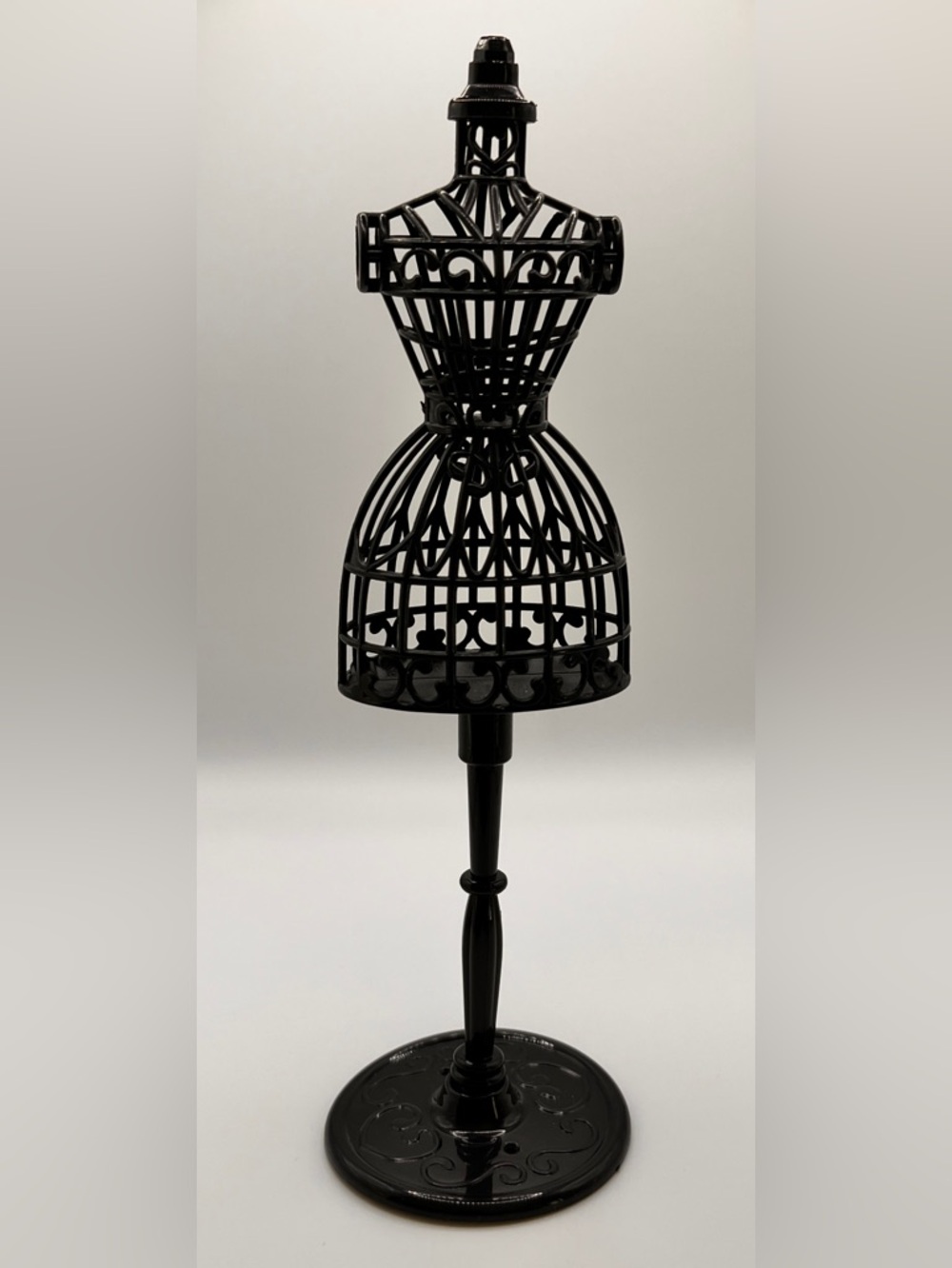 Black, plastic, doll size dress form